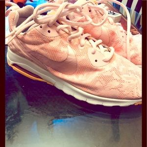 Women Nike floral mesh print sneakers.